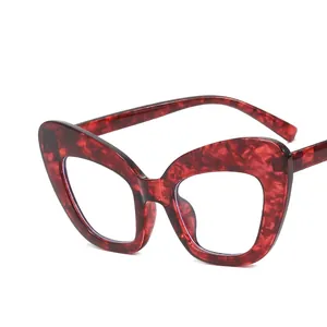 Stylish cat-eye blue light blocking glasses with a red marble tortoiseshell frame