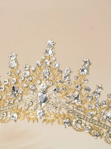 Close-up of golden princess crown with intricate crystal embellishments for girls