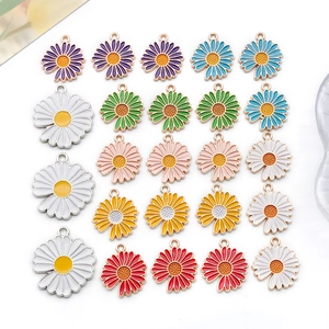 Macro shot of colorful enamel daisy flower pendants for DIY jewelry and earrings