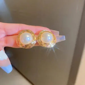 Vintage style gold spiral twist pearl stud earrings with elegant French design for women