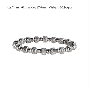 Detail of 7mm sparkling textured silver stainless steel beaded elastic bracelet