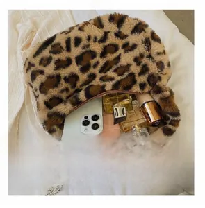 Faux fur leopard print tote bag interior showing capacity for cosmetics and phone