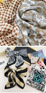 Detailed macro view of soft satin square scarf showing houndstooth and floral textures