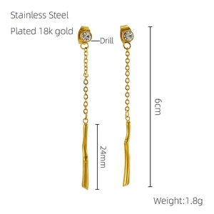 Detail view of 18k gold plated stainless steel tassel earrings with size and weight specs