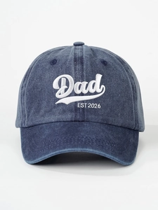 Close-up of Dad EST 2026 white embroidery on blue washed denim baseball cap