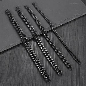 Men's titanium steel cuban link bracelets in four distinct widths on stone background