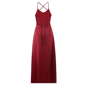 Detail showing the lace-up back and satin finish of the dark red slit evening dress