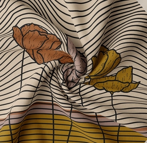 Macro detail of Morandi art wall tapestry fabric with caramel floral and striped patterns