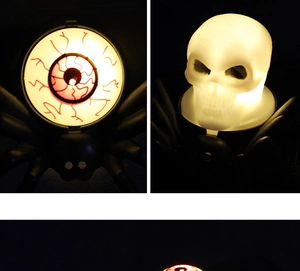 Close-up of Halloween LED spider candles with glowing eyeball and skull motifs