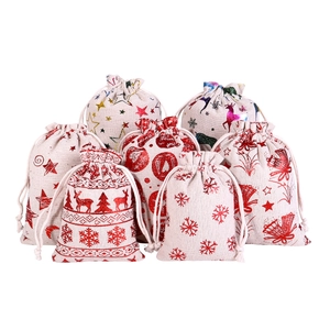 Set of Christmas cotton linen drawstring gift bags with reindeer and snowflake patterns