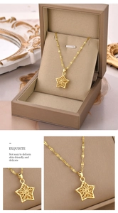 Macro detail of gold star pendant necklace with delicate hollow-out design and texture