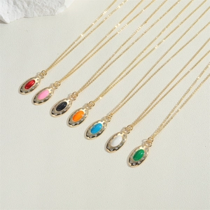 Close-up of vibrant zircon oval pendants in various colors with gold chains