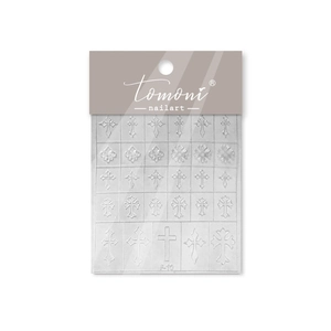 Detailed relief nail art stickers featuring white cross and lily patterns for manicures