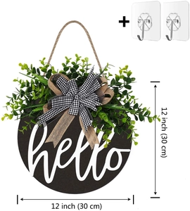 Close-up of 12-inch wooden door wreath with hello text, green plants and plaid bow