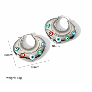 Detailed view of silver evil eye crescent hoop earrings with measurements and weight