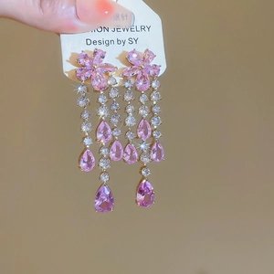 Detail showing S925 silver needles and pink heart zircon tassels on luxury earrings