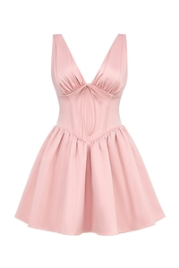 Detail of light pink mini dress featuring a deep V-neck, lace-up front and corset waist
