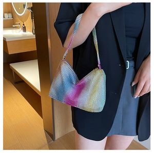Close-up of rainbow gradient rhinestones on a stylish hobo underarm evening bag