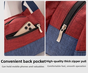 Close-up of the smooth metal zipper and functional rear pocket on the bicolor lunch bag