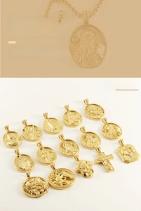 Detailed macro view of 3D embossed pendants with religious and animal carvings