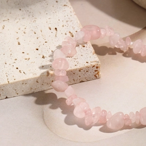 Close-up of natural rose quartz irregular stone beads elastic bracelet for women