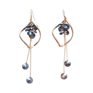Elegant rose gold drop earrings featuring dark blue crystals and long chain tassels