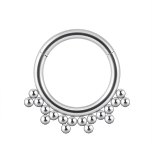 Close-up of silver stainless steel septum clicker ring with cluster bead detail