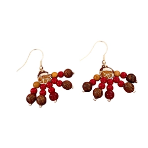 Boucles d'oreilles ethniques bohèmes avec perles en bois vintage et détails rouges