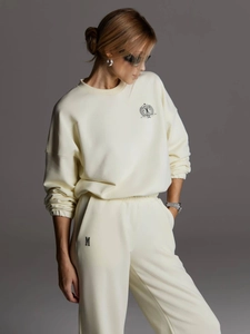Ensemble sweat à col rond et pantalon droit crème pour femme avec badge brodé