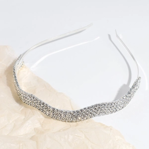 Sparkling silver rhinestone headband with geometric wave design for women's hair styling