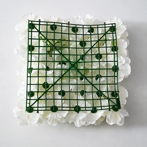 Detail view of the durable green plastic grid backing for artificial floral wall panels