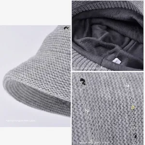Grey knit beanie with soft plush lining and colorful stripes for winter warmth