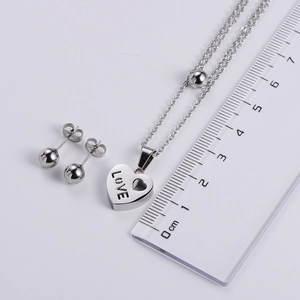 Polished silver titanium steel set featuring love heart pendant and ball stud earrings