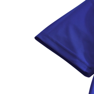 Detailed close-up of blue polo shirt cuff showing breathable mesh fabric and neat stitching