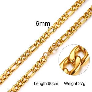 Detail view of 6mm gold Figaro chain showing thick stainless steel links and lobster clasp
