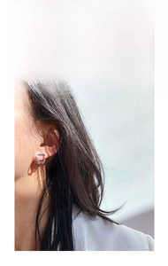 Minimalist square silver earrings shown on model with polished geometric design