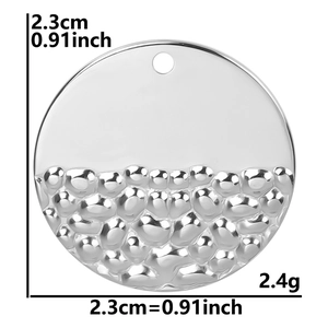 Detail of silver hammered stainless steel round pendant with 2.3cm diameter and 2.4g weight