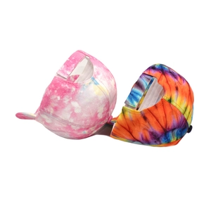Detail of colorful tie-dye baseball caps with adjustable velcro straps and 3D print design