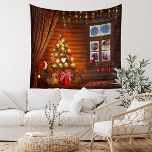 Detail of Christmas tapestry featuring a teddy bear and festive tree on a white wall