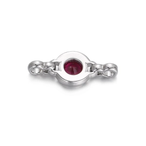 Close-up of a silver connector with a round red zircon gemstone for jewelry making