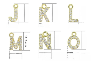 Macro view of gold-plated micro-pave letter charms with dimensions from J to O