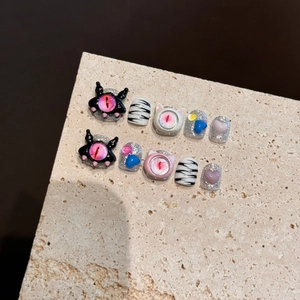 Handmade 3D monster eye press-on nails with zebra stripes and glitter hearts
