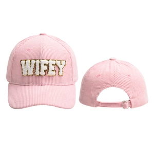 Detail of pink corduroy baseball cap with sequined WIFEY embroidery and adjustable metal buckle