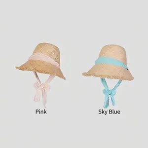 Raffia straw sun hats with chiffon ties in pink and sky blue colors for summer beach