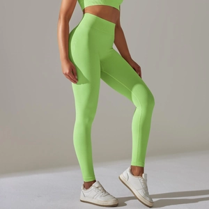 Detail view of seamless fluorescent green knit yoga pants showing body-shaping texture