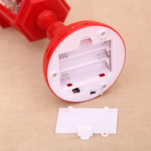 Detailed base of Christmas water lantern showing the 3 AA battery compartment and switch