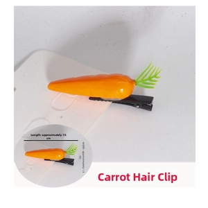 Detailed size view of carrot hair clip with green leaves and black metal duckbill clip