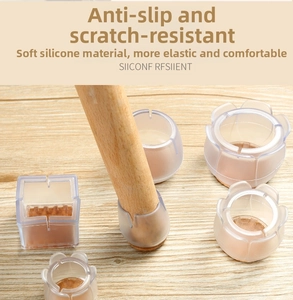 Detail view of transparent silicone chair leg protectors showing multiple shapes on wood floor
