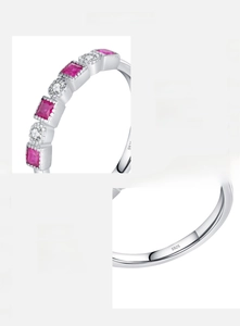 Macro detail of S925 sterling silver stamp on a princess-cut red zircon ring band