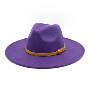 Detail of purple wide brim fedora hat with brown braided leather decorative band